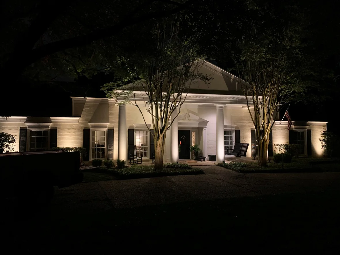 hl-com-columns-1180.webp Colonnade and landscaping of a commercial property lit at night