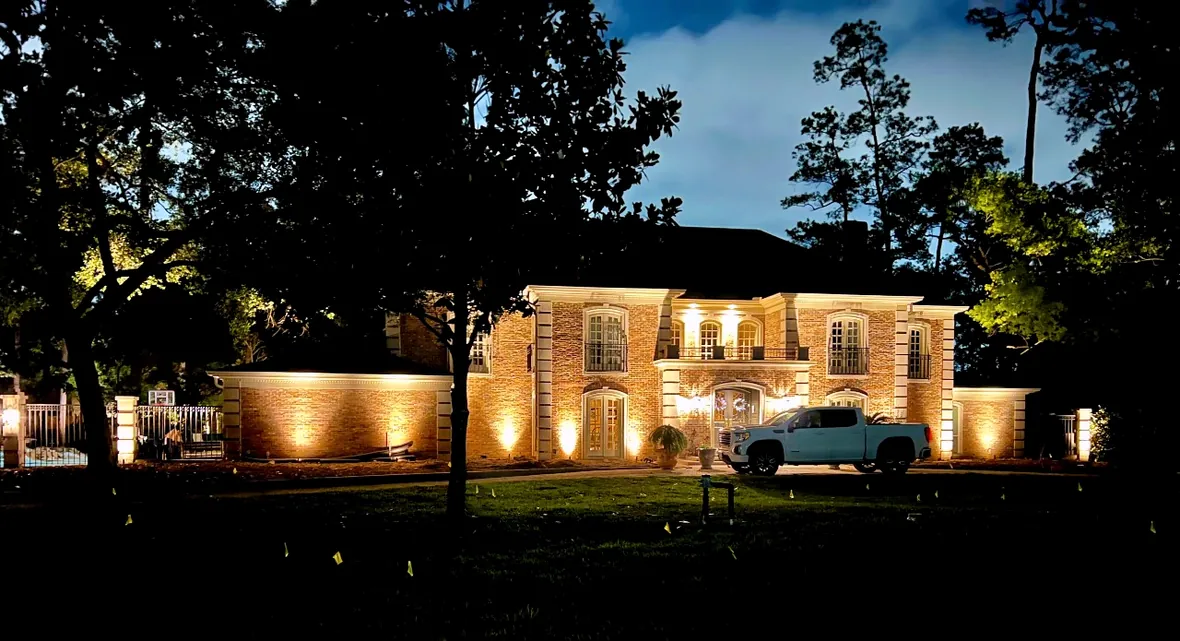 hl-home-maintenance-system-1180.webp Established landscape lighting system on a Houston property, serviced and adjusted at night