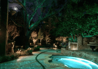 House with pool and landscape lighting