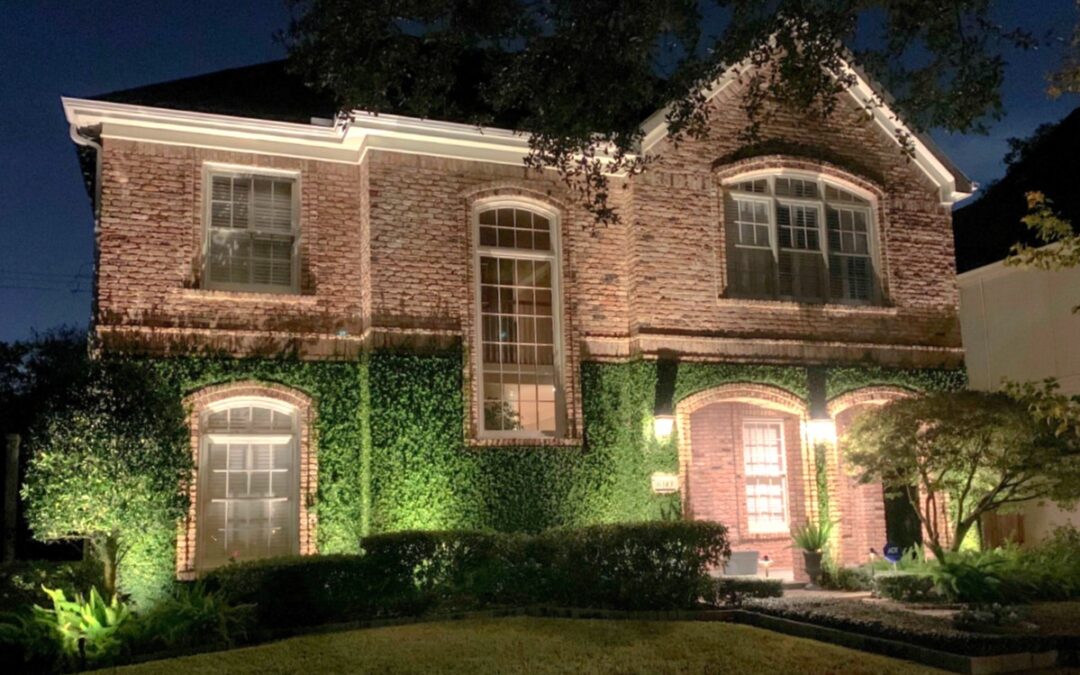 Wondering where to place landscape lighting? This brick house with ivy growing up the left side is a perfect example