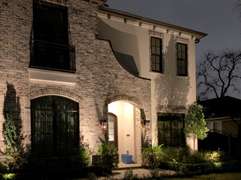 Outdoor lights illuminating a home entryway for safety and security