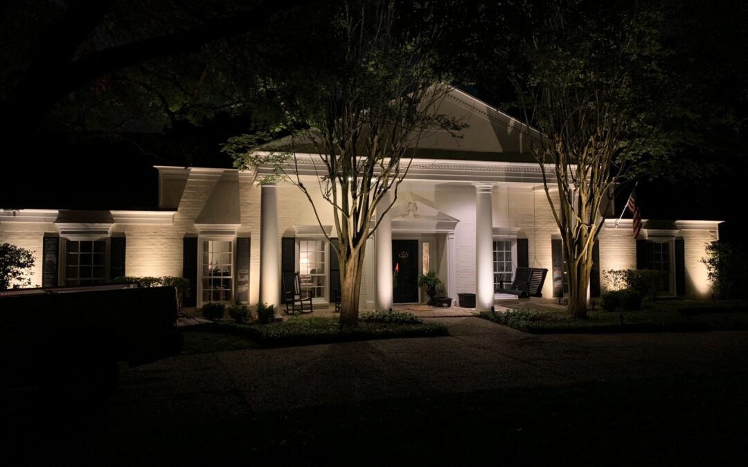 Outdoor Lighting Highlights The Architectural Feature Columns of a home on a dark evening