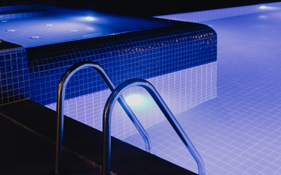 Pool lighting options - steps of pool lit in the evening