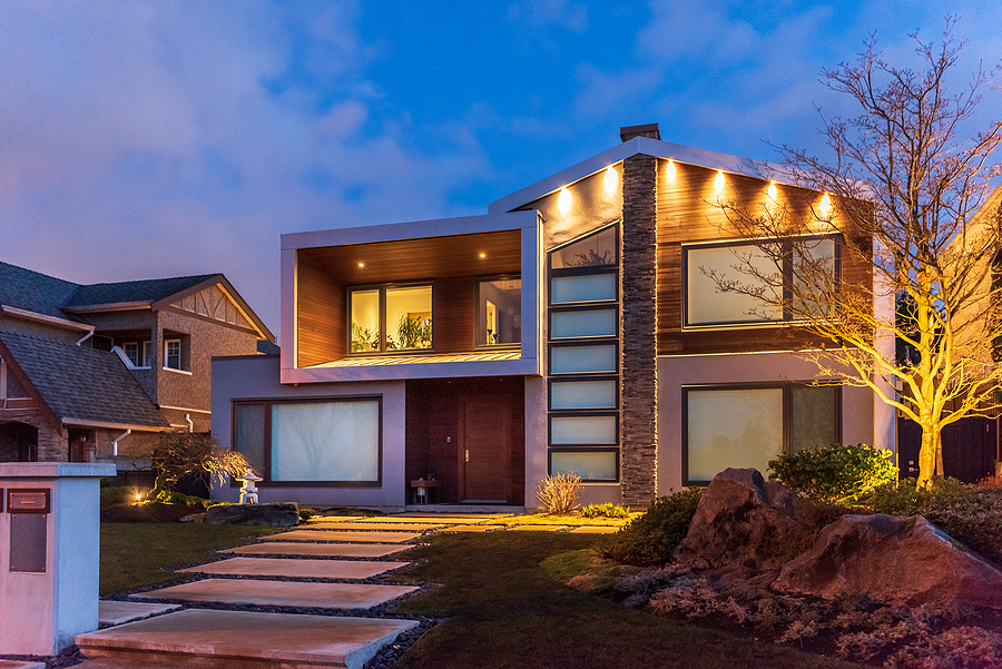 Common Exterior lighting on exterior of modern house at sunset