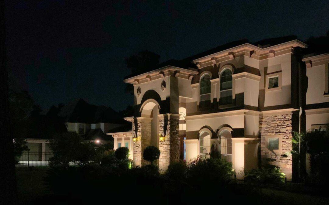 Wash lighting illuminates architecture front of home at night