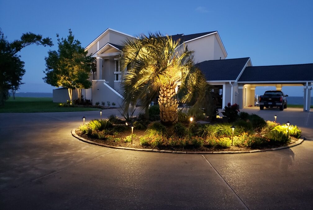 Outdoor lighting on circular driveway in front of house