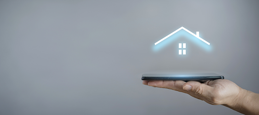 Businessman hold house icon.Smart home controlled, intelligent house, and home automation app concept.Pcb design and person with smart phone. Innovation technology internet Network Concept. houston lightscapes