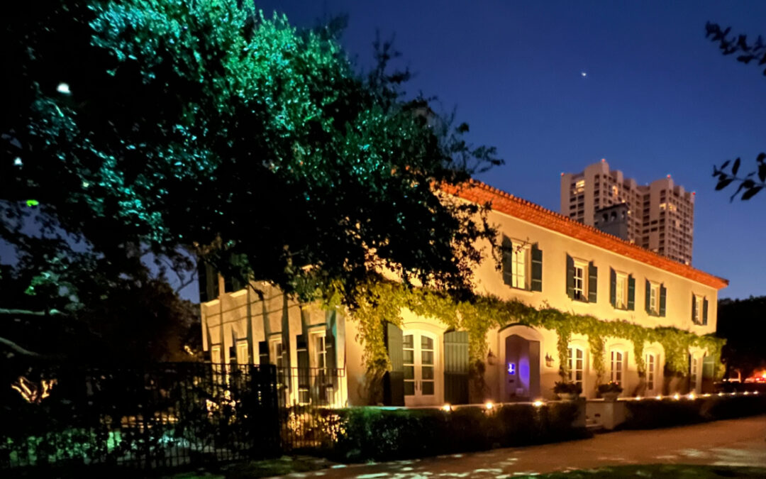 Front of home exterior at dusk highlighting what can be done with landscape lighting design.